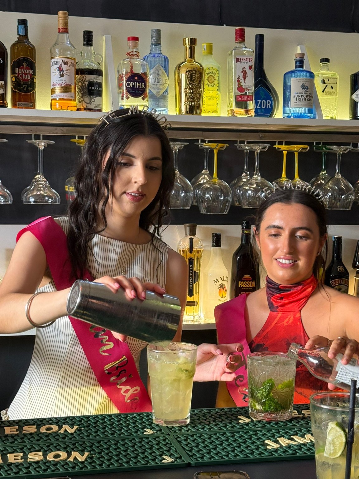 Guests enjoying a cocktail masterclass at The Spot Lisboa