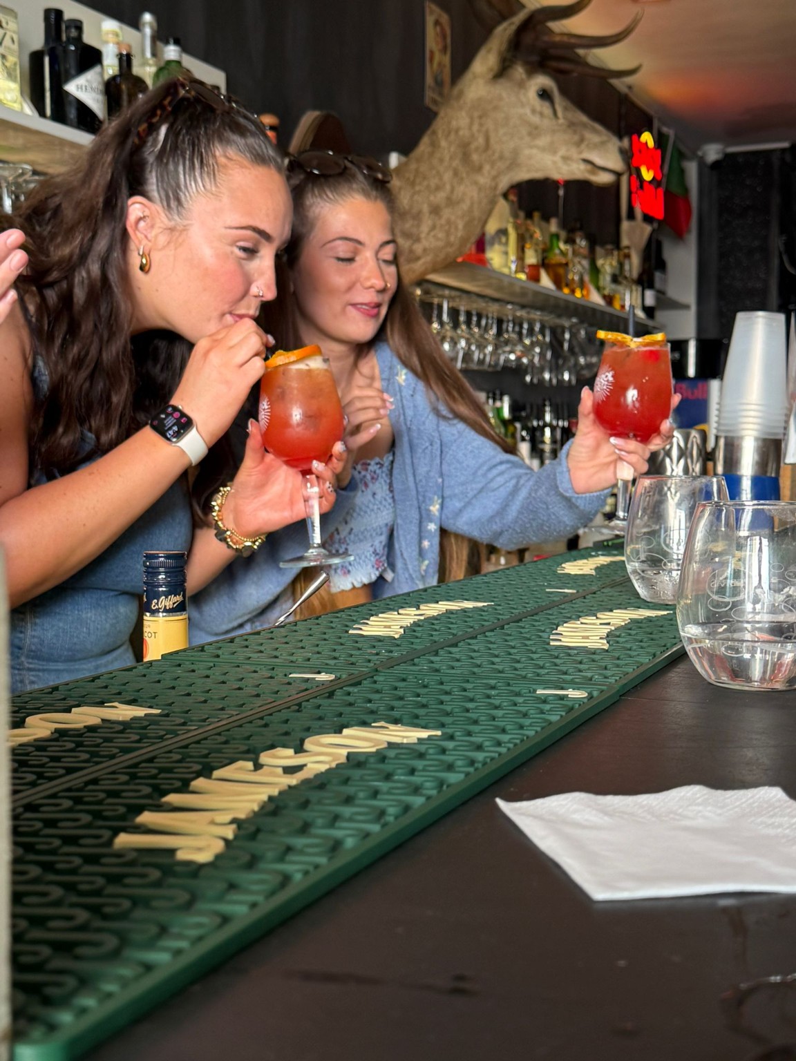 Guests enjoying a cocktail masterclass at The Spot Lisboa