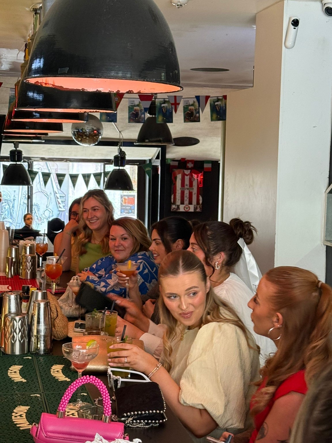 Guests enjoying a cocktail masterclass at The Spot Lisboa