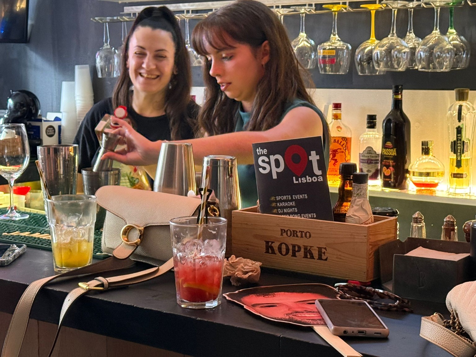 Guests enjoying a cocktail masterclass at The Spot Lisboa