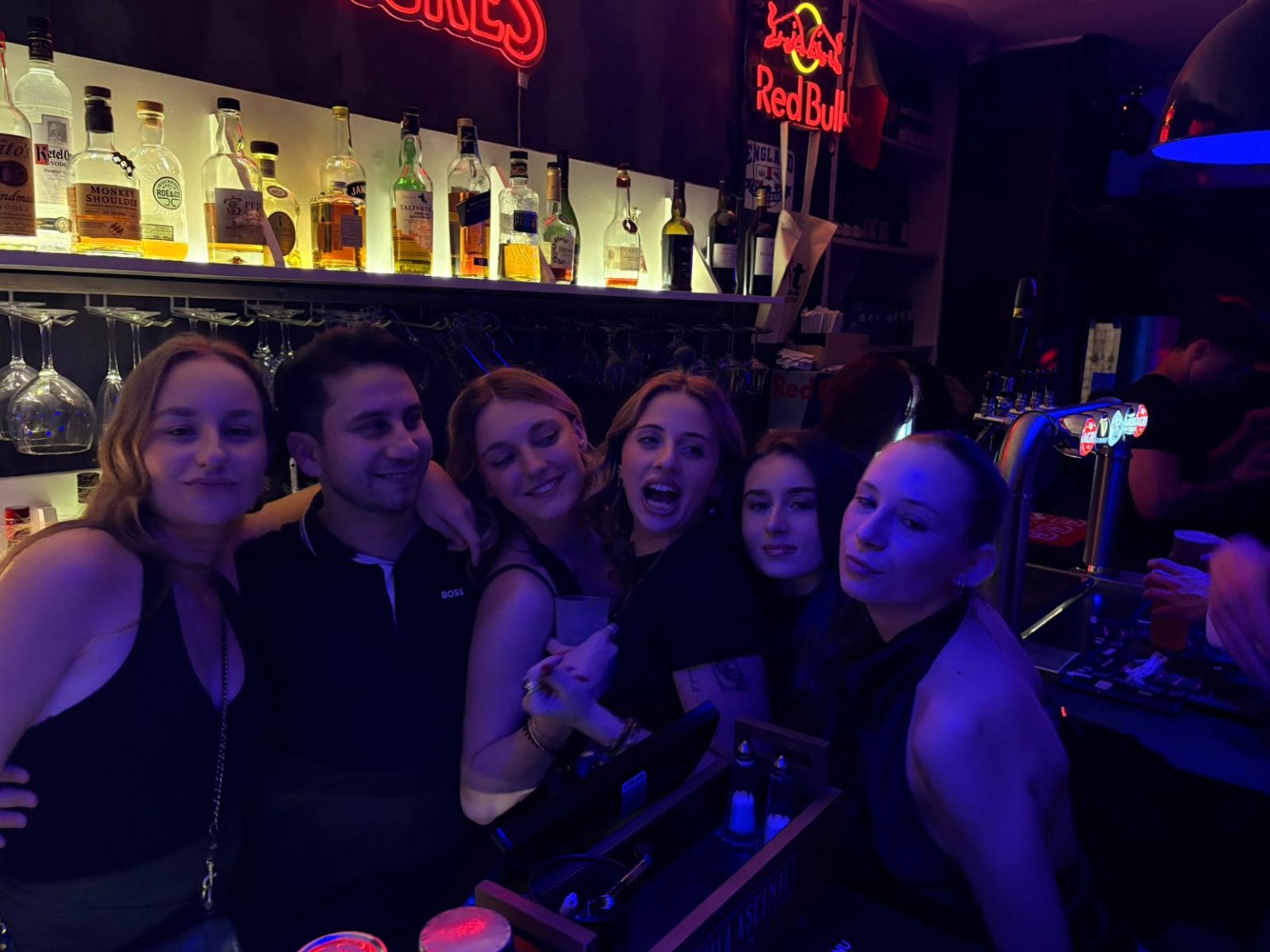 Friends together at the bar at The Spot Lisboa